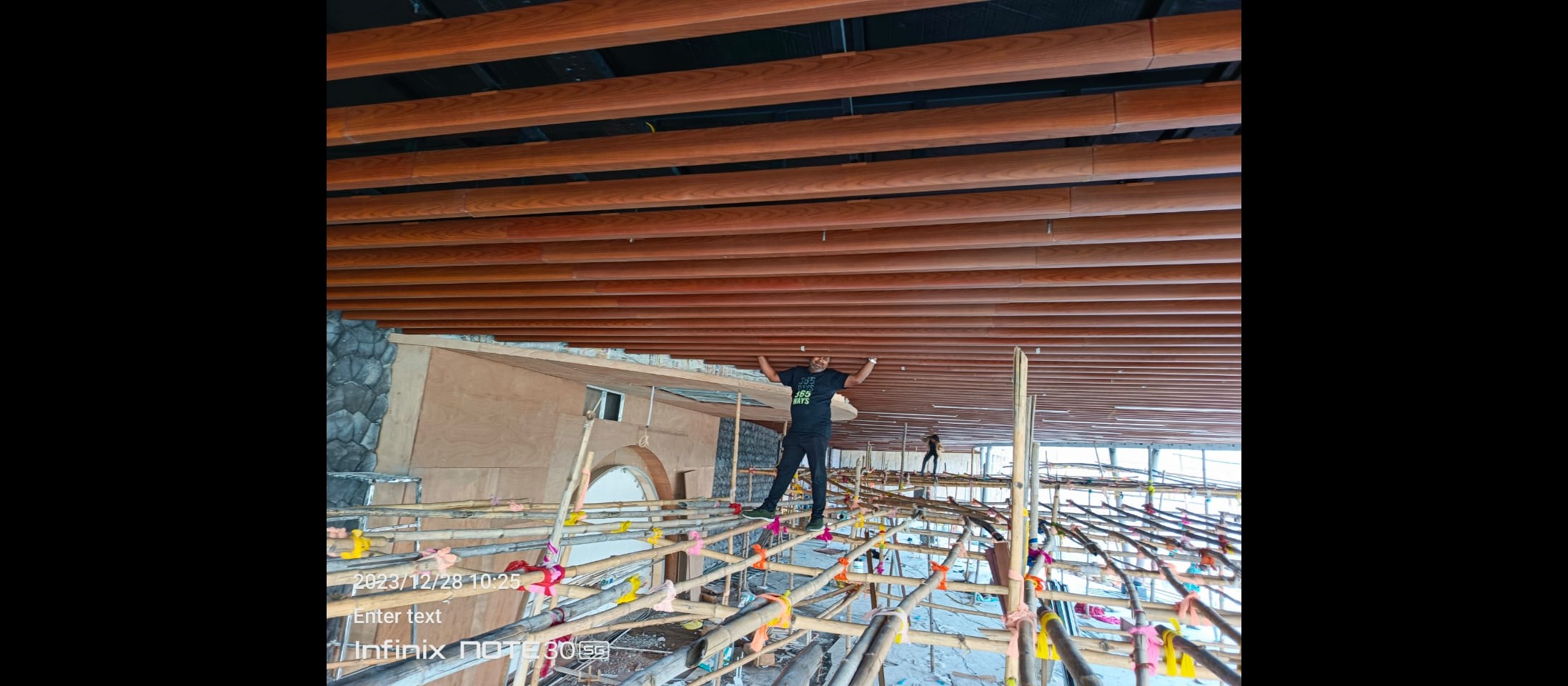 Aluminum U-shaped baffles with a wooden finish are