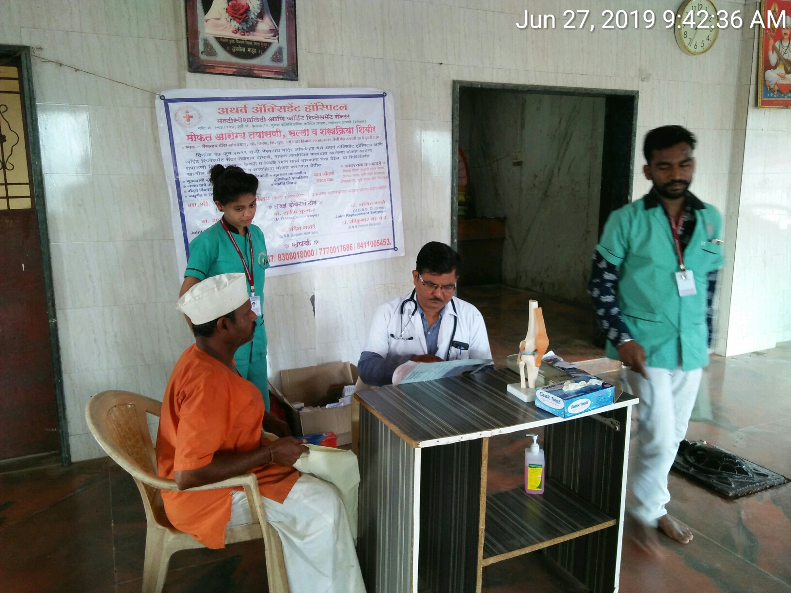 Dr Kulkarni screening the pt in Orthopedic camp  main image