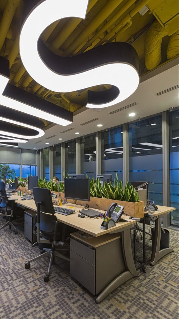 Biophilic Office Workstations with Sculptural LED Ceiling Lighting
