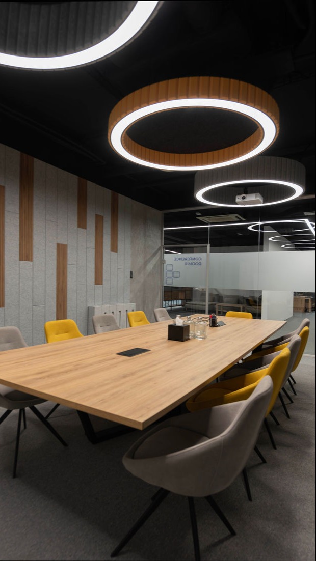 Premium Conference Room with Wooden Meeting Table and Acoustic Wall Panels