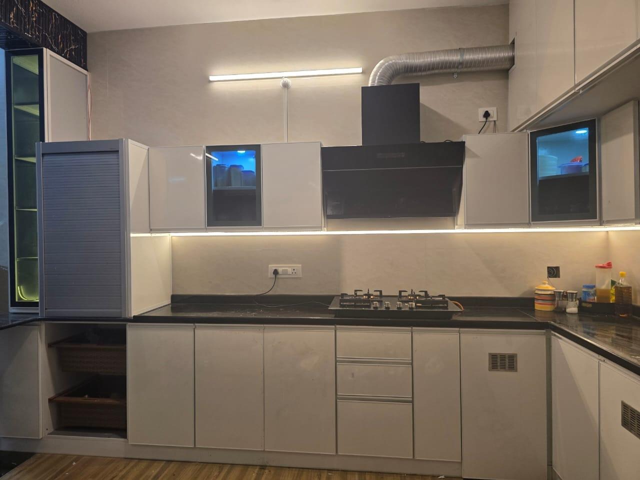 Parallel Modular Kitchen with Glossy Cabinets and Black Countertop