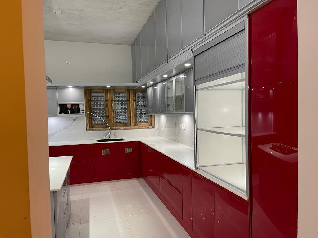 Compact L Shaped Modular Kitchen with Glossy Red Cabinets