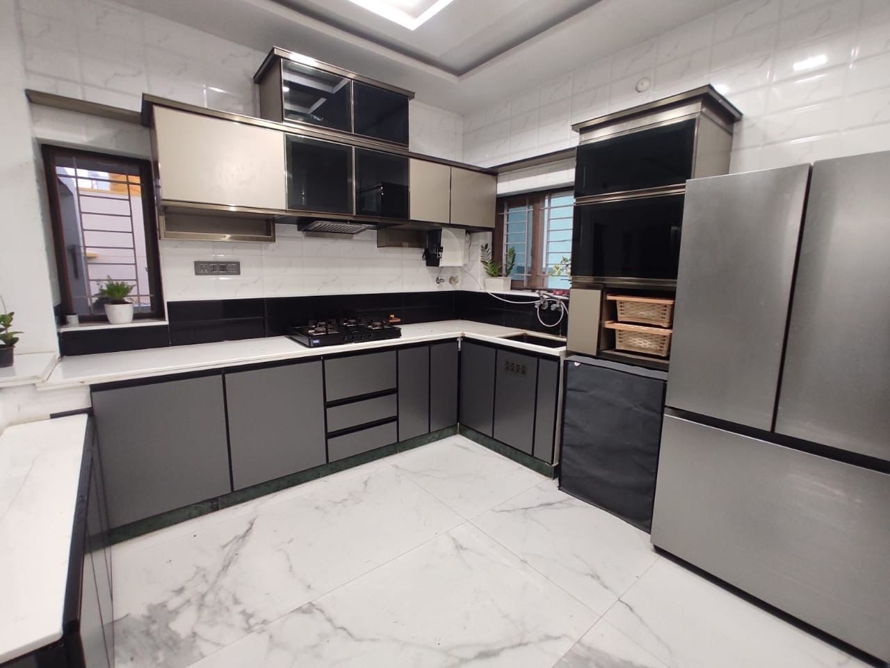 Contemporary Grey Modular Kitchen with Black Accents and Tall Storage