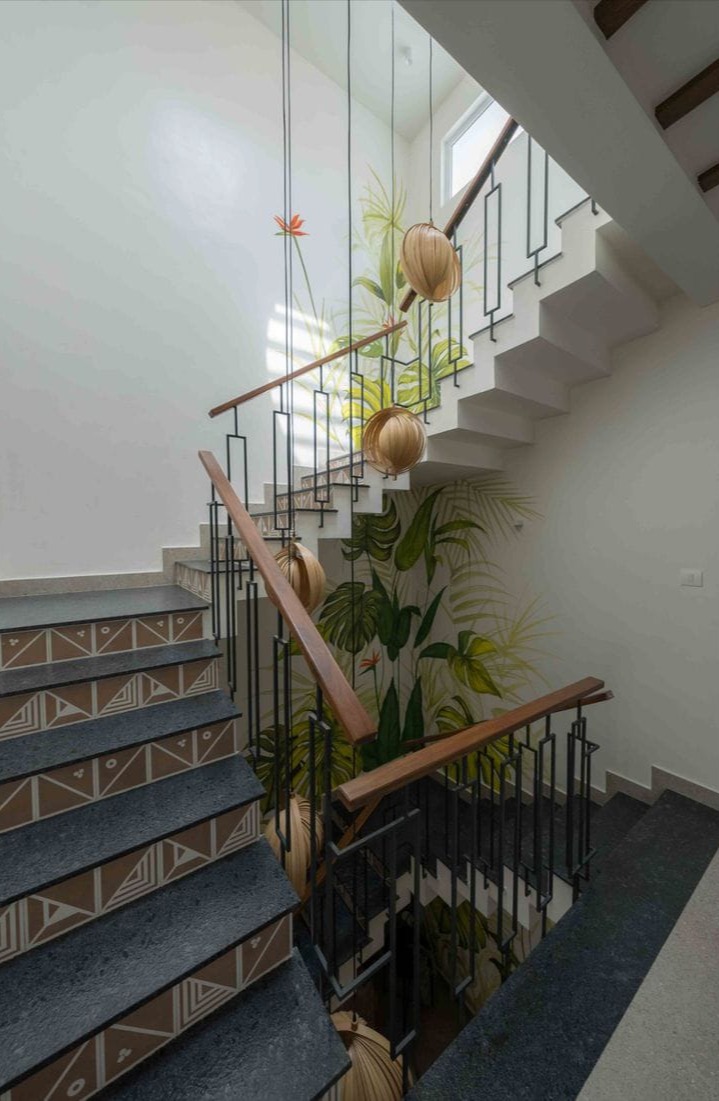 Staircase With Artistic Tiles And Tropical Interior Design