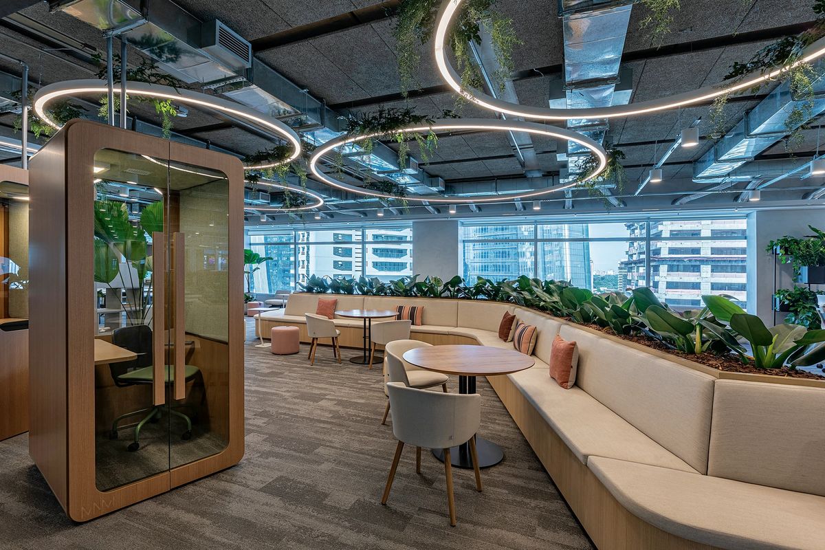 Modern Office Lounge Interior Design with Curved Seating and Greenery | Adyar