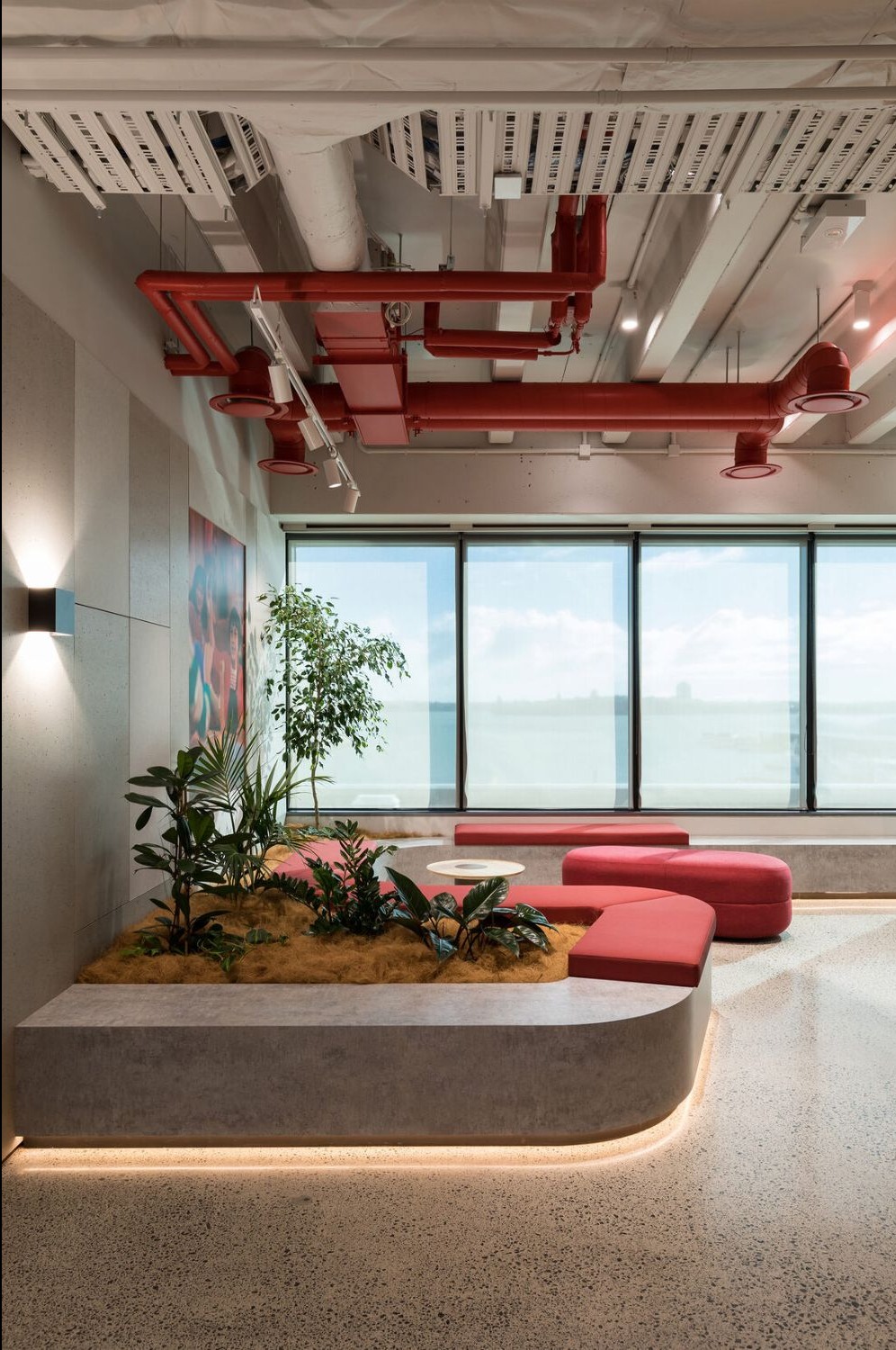 Contemporary Office Breakout Area Design with Integrated Planters and Curved Seating | Velachery
