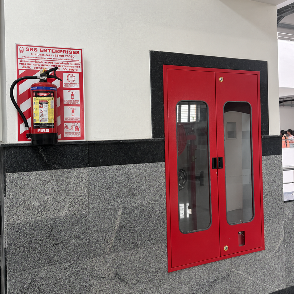 Wall-Mounted Fire Hose Cabinet with Adjacent Fire Extinguisher
The fire hose cabinet shall be a wall...