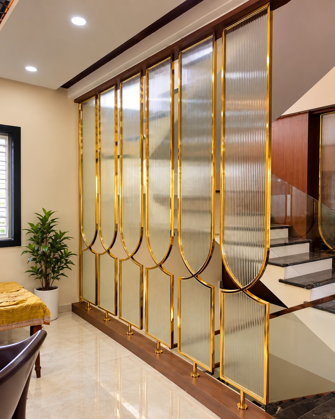 Gold-Framed Fluted Glass Staircase Partition Design | OMR