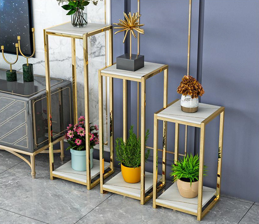 Model No: FST441869Size: 35*/ 60+80+100 cmDescription:The base of the side table is constructed using rectangular tubes, which are hollow metal bars with a rectangular cross-section. The side table incorporates two decks or shelves, positioned one above the other.