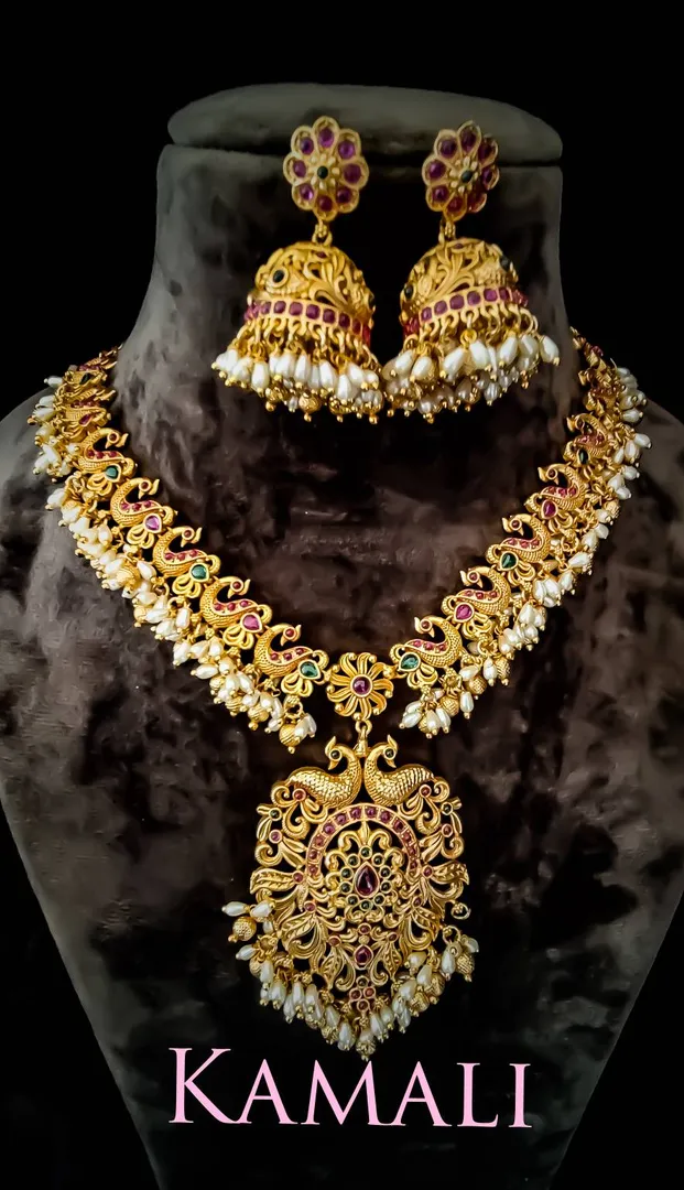 Antique Necklace
Rice Pearls Necklace with jumkas...