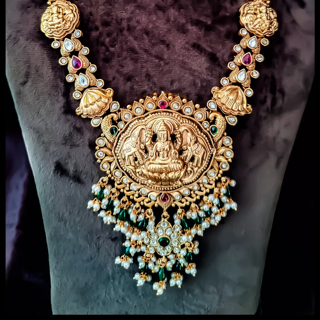 Gaja Lakshmi Antique Haram
Adorned with Kempu sto...