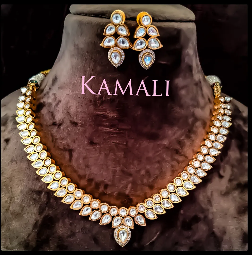 Kundan Necklace Set with Jumkkas
Kamali Queen Rad...