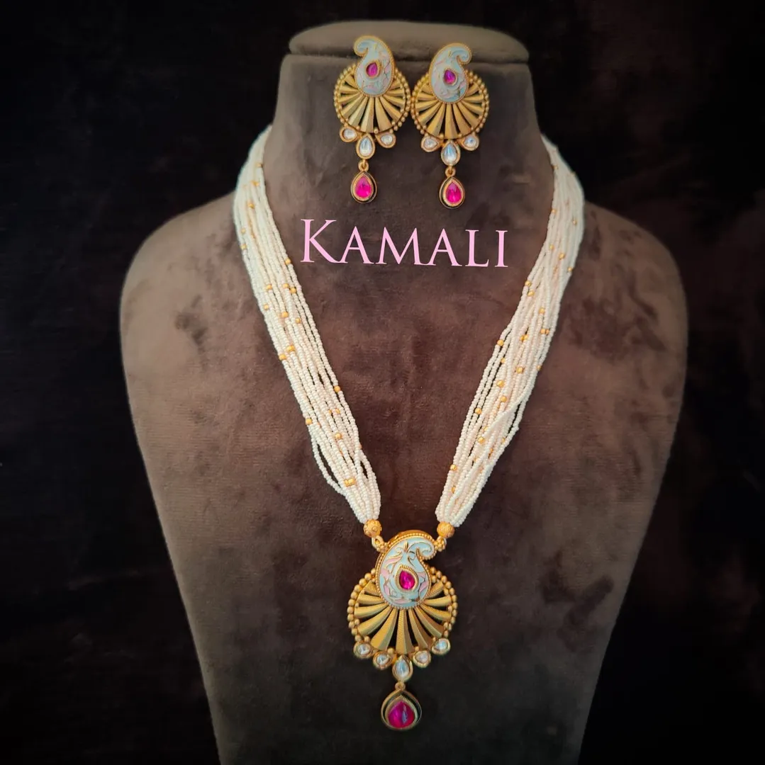 Pearl Long Chain with Kundan Pendant Set
Adorned ...