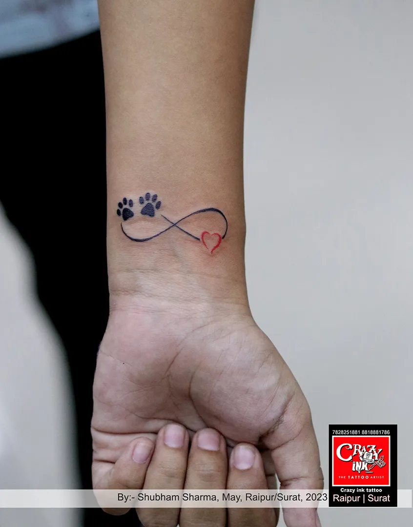 INFINITY WITH DOG FOOT PRINT TATTOO DESIGN
...