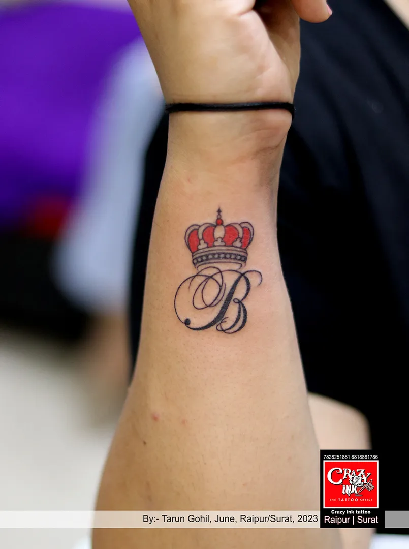 ALPHABET WITH CROWN TATTOO DESIGN
By:- tatt...