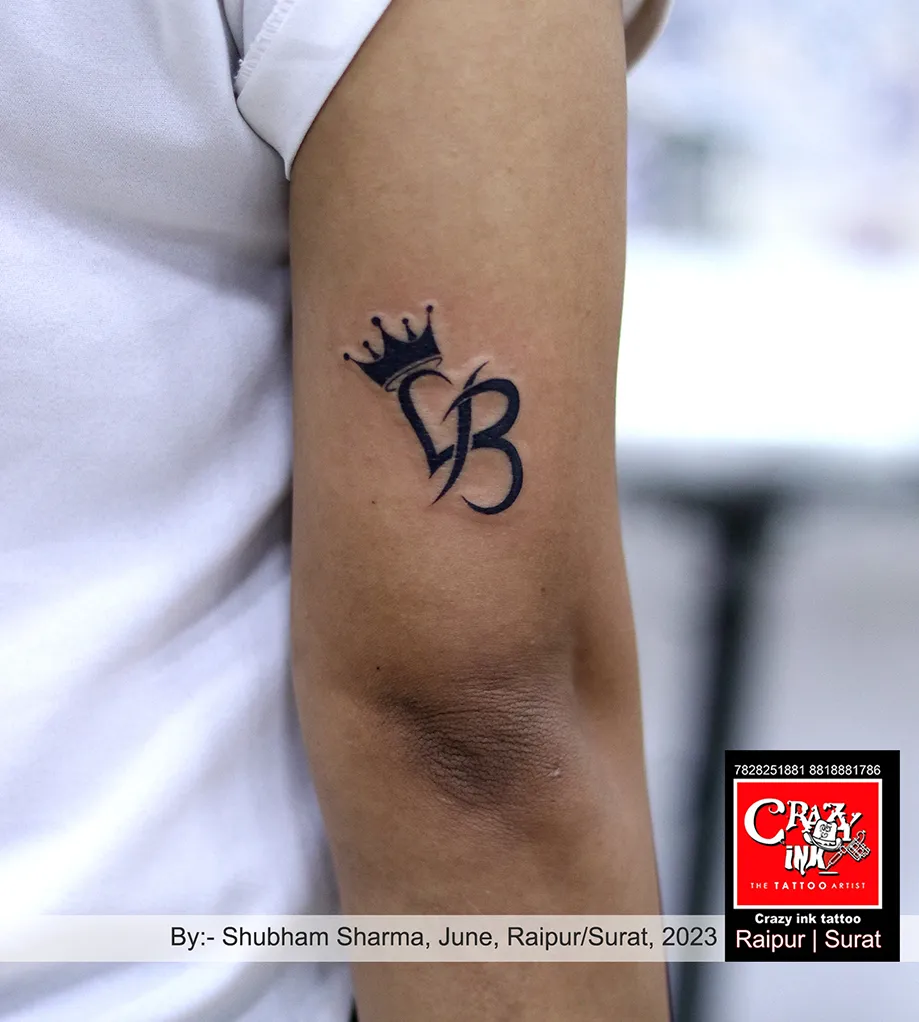 ALPHABET WITH CROWN TATTOO DESIGN
By;- tatt...
