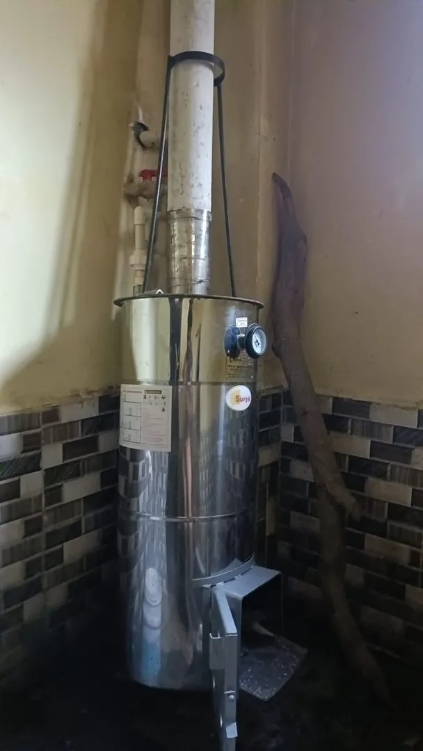 Wood-fired water heaters provide independence from...