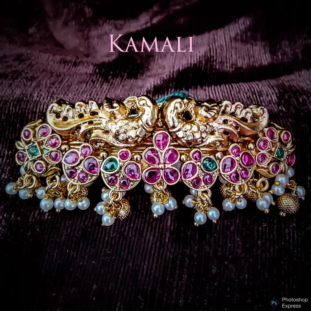 Hair Clips adorned with Kempu stones and Pearls
K...