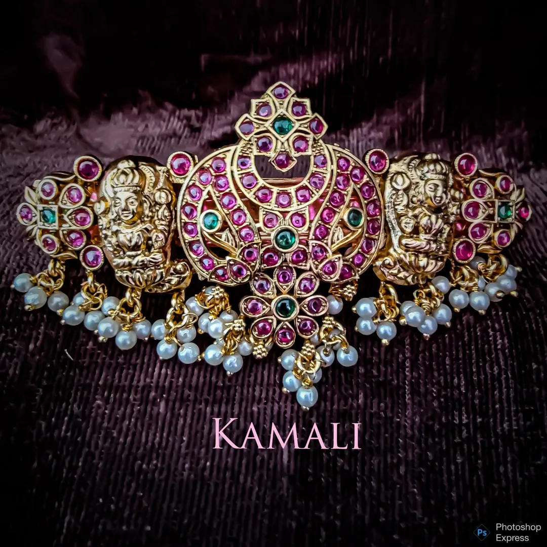 Hair Clips adorned with Kempu stones and Pearls
K...
