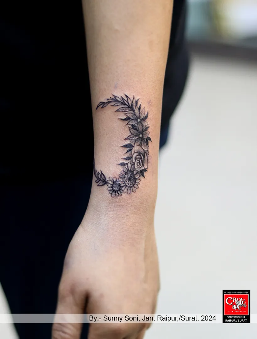 FLOWER TATTOO ON MOON SHAPS,
A moon tattoo ha...