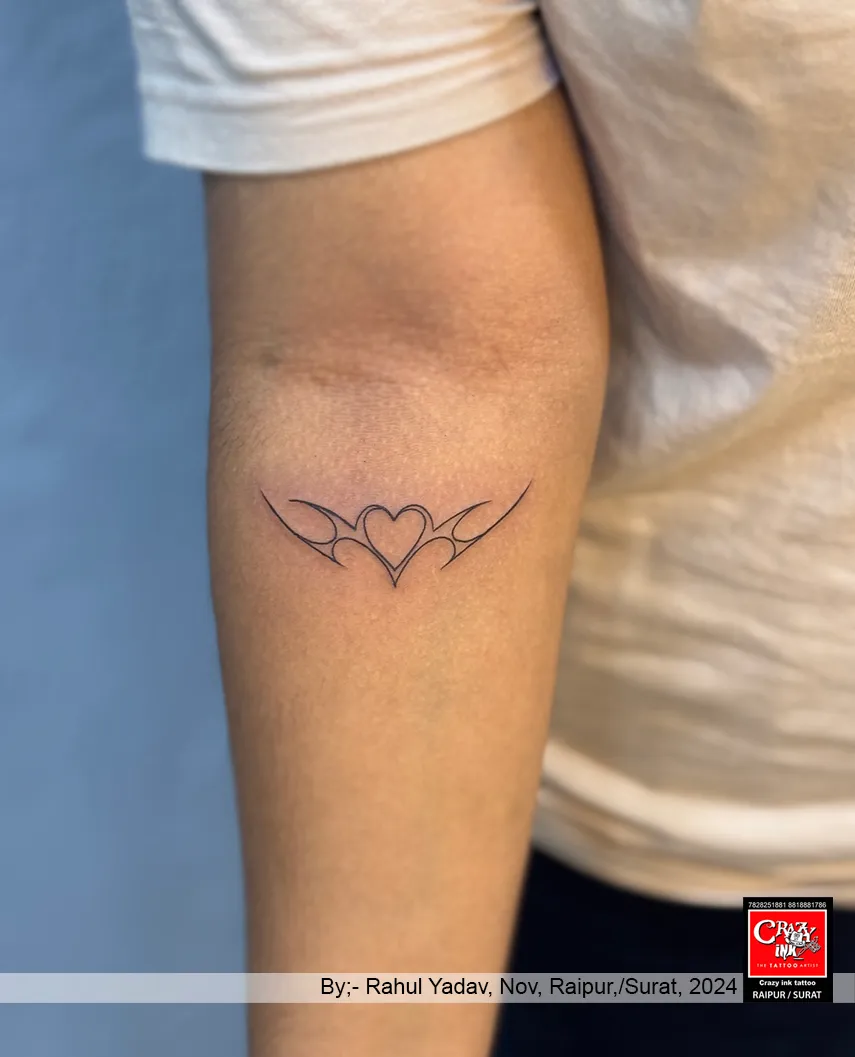 Minimalistic Tribal Heart Tattoo
This tattoo ...