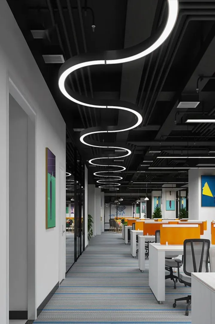 Sculptural Wave Lighting Office with Vibrant Orange Workstations