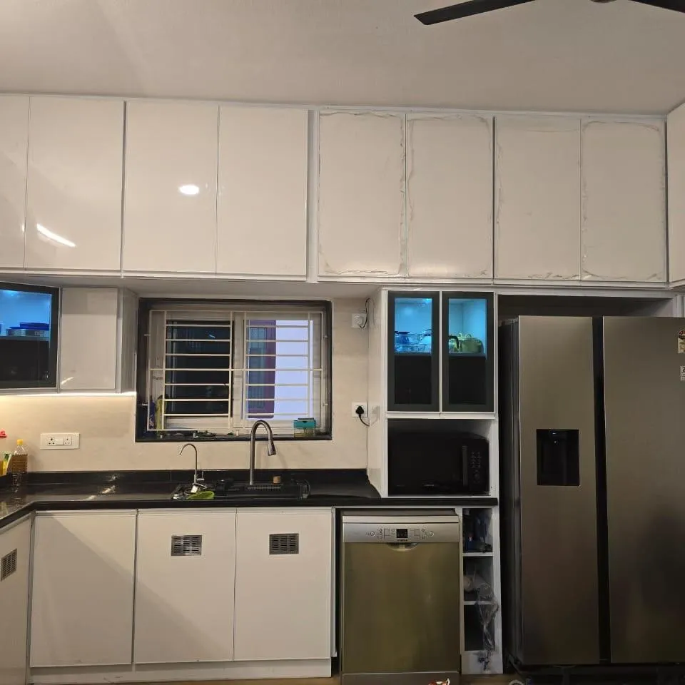 L-Shaped Modular Kitchen with Glossy White Finish