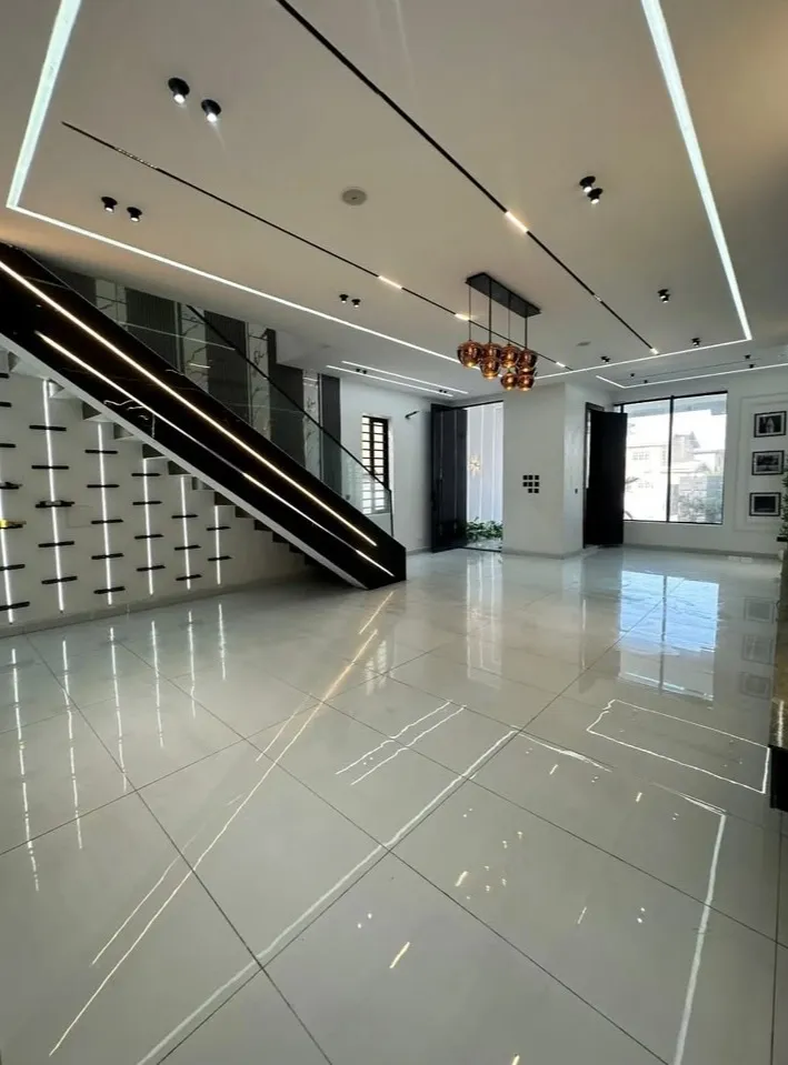 Elegant pendant light installation living room false ceiling design