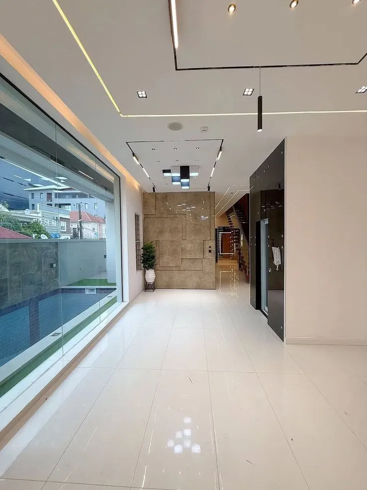Large glass windows with outdoor views
interior design