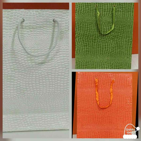 Best quality of handmade paper bags looks as natural as real Crocodile leather. These Crocodile leather handmade paper bags can be obtained in various sizes for various occasions gift bags, return gift bags in functions, trendy shopping bags etc