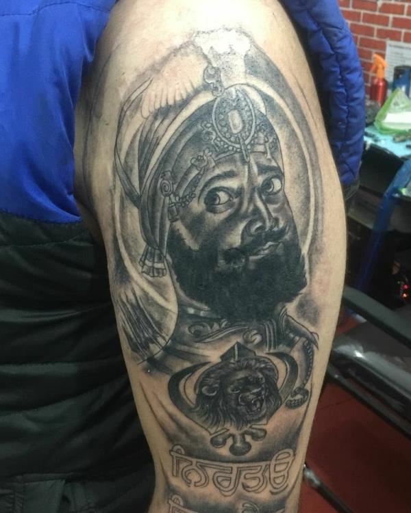 Waheguru tattoo done at the best tattoo 