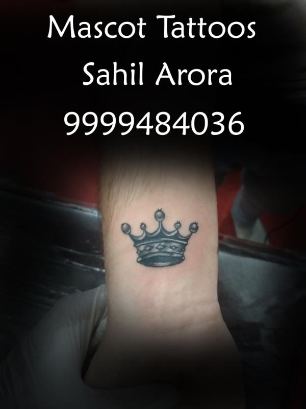 Crown tattoo done at the best tattoo stu