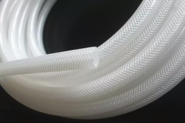 Silicone braided hose is thick tubing in which a polyester or Nylon multifilament yarn braiding is sandwiched between two silicone layers to give reinforcements. These hoses can withstand high pressure due to reinforcements. Due to the rigidity of the structure, certain silicone steel coiled hoses are extremely efficient in preventing wall collapse during vacuum pressure. Himsan Polymer has the expertise and in-house facility to manufacture these hoses These food grade silicone hoses are extensively used in Pharmaceutical, healthcare, cosmetics, and life science fields because of their transparency, chemical inertness, and rigidity. Chemically extremely stable and suitable for use with many acids, alkalis and other pharmaceutical cleaning agents. Hence one of the best material for transfer of fluid under high pressure. Benefits of using our silicon braided hose:- 100% food grade ( FDA Compliant USP-21CFR177.2600 and USP Class Vl complaint) UV, ozone and Corona resistant Burst pressure test certified hoses. Autoclavable. Types of silicone braided hose:- Silicone hose with single nylon braided Silicone double braided nylon hose fabric wrapped silicone braided hose Steel coiled silicone hose (Note: Stainless steel Clamp fitted in custom lengths on request) Applications for silicone braided hose:- Transfer and monitoring of high pressurized fluids in pharmaceutical industry Used in Dairy industry because of chemical stability Health care and cosmetics industry use silicone braided hoses to transfer raw materials Used for transfer of bacterial growth feeds and Ph balancing fluids in life sciences and virology labs . For fitting clamps on custom length or for any other details email us or send us an enquiry. Our team will get back to you as soon as possible. Email:- info@himsanpolymer.com Mob:- +91-7715871508