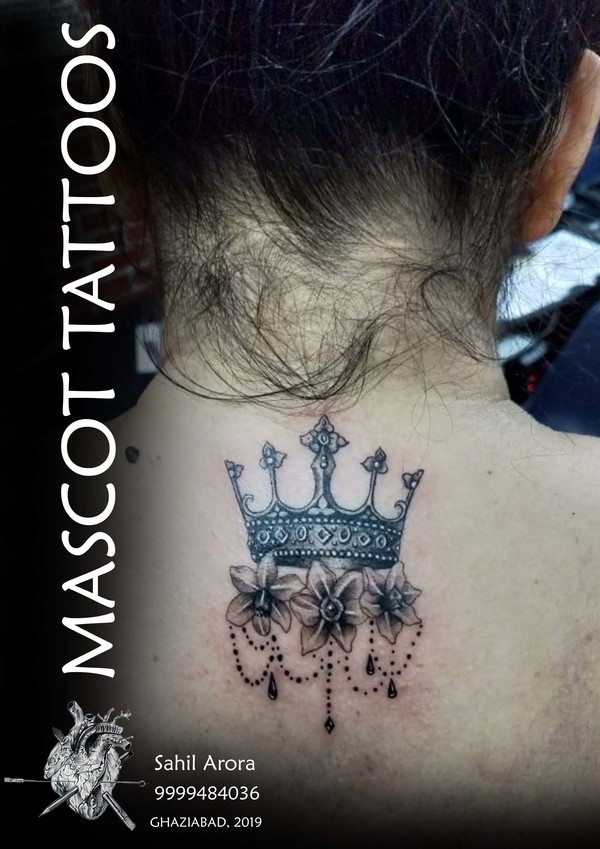 Crown tattoo at back done at the best st