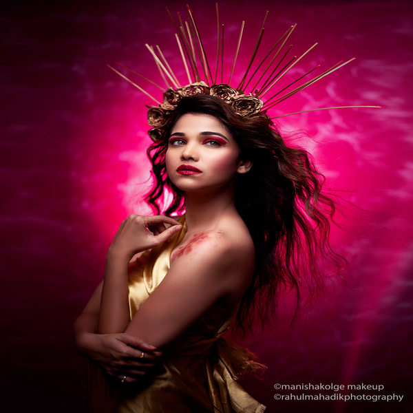 Conceptual makeup -
Woman in gold flower