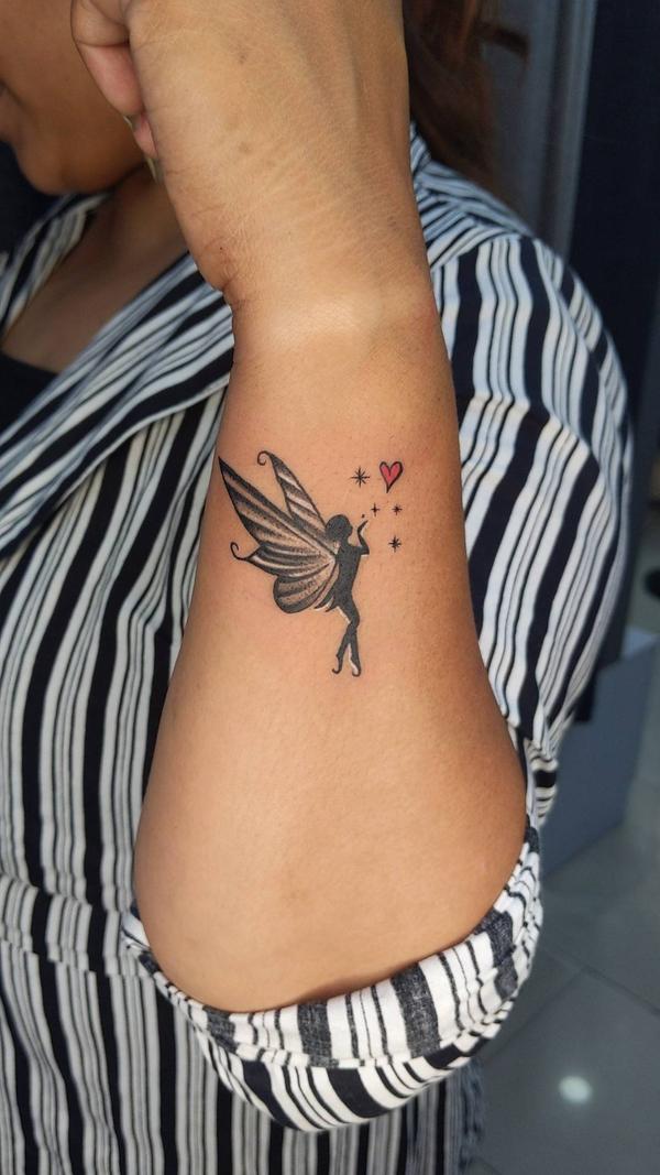 Tinkerbell Tattoo done on side wrist . T