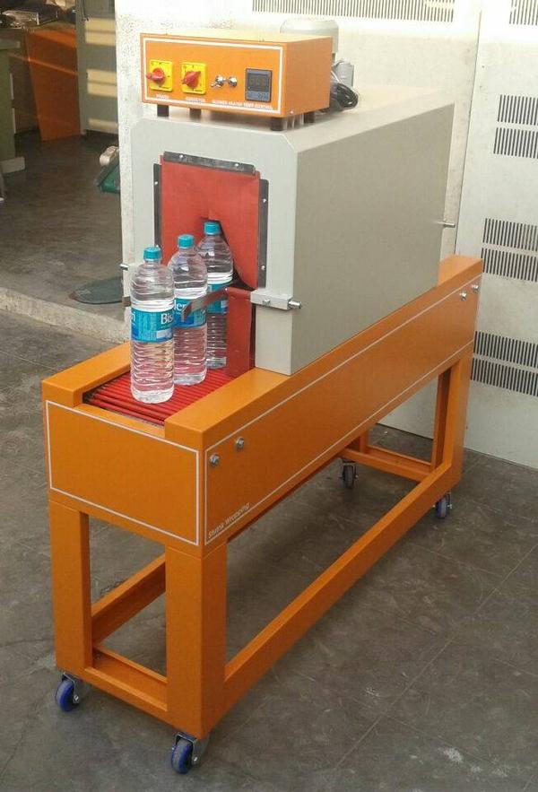 Bottle shrink wrapping machine
