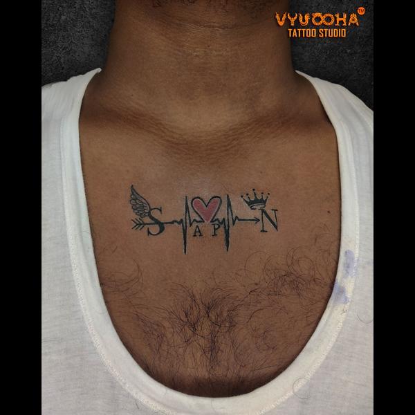 chest tattoo with crown and wi