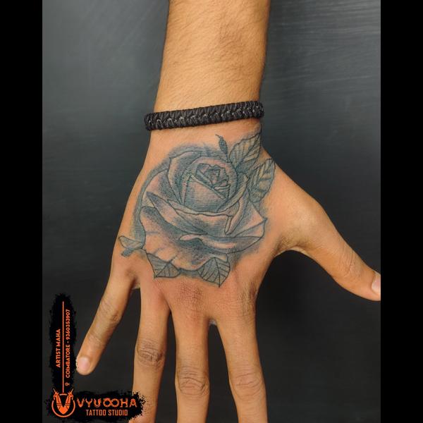 realistic floral tattoo on han