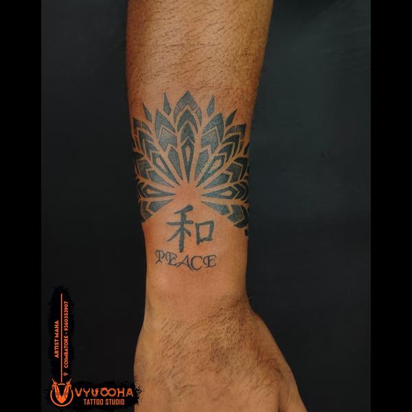 black ink mandala tattoo sowri