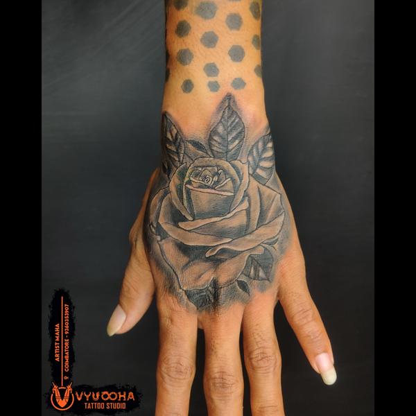 black and grey rose hand tatto