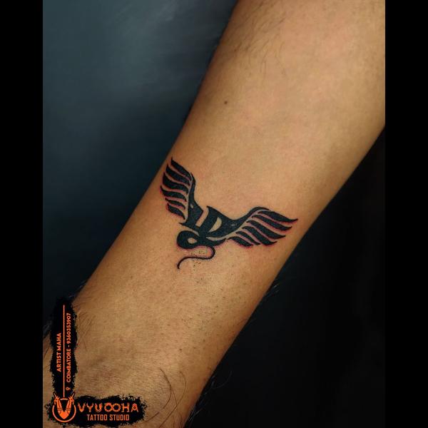 winged symbol tattoo coimbator