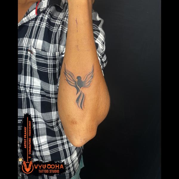 elegant flying bird tattoo coi