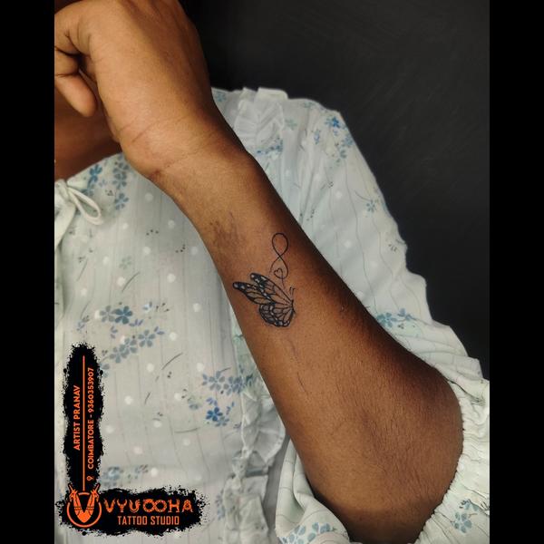 minimalist butterfly tattoo ar