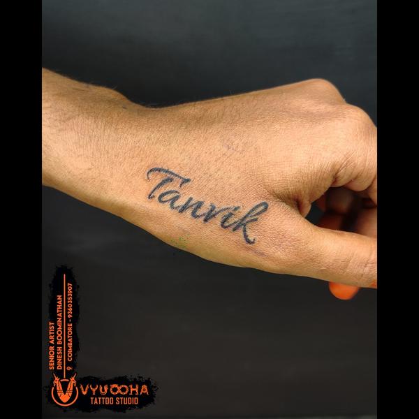 crowned wrist tattoo near ukka