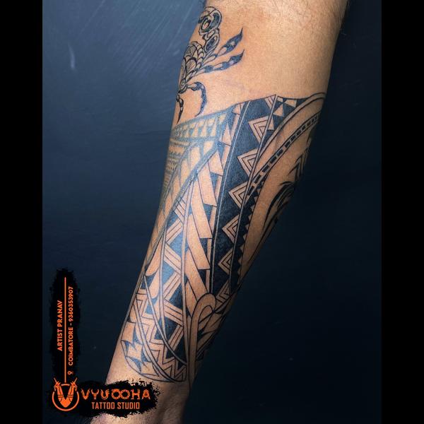 geometric tribal sleeve tattoo