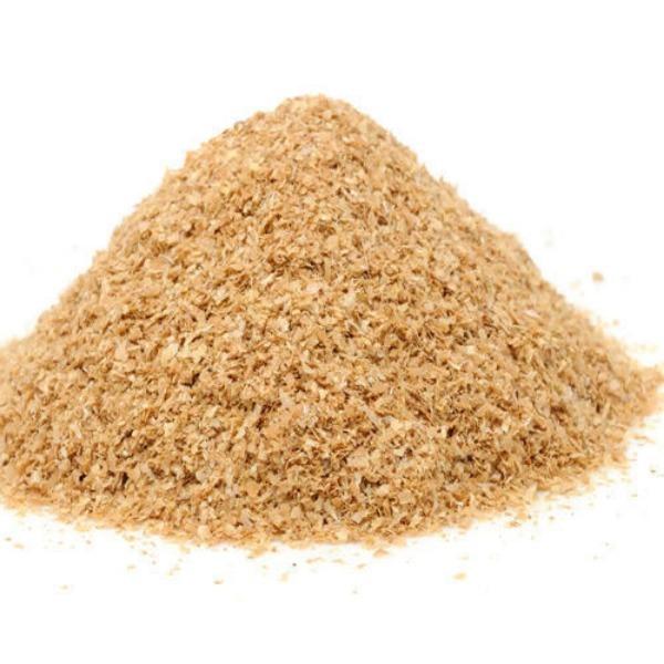 Wheat bran in cattle feed appears as coarse, flaky