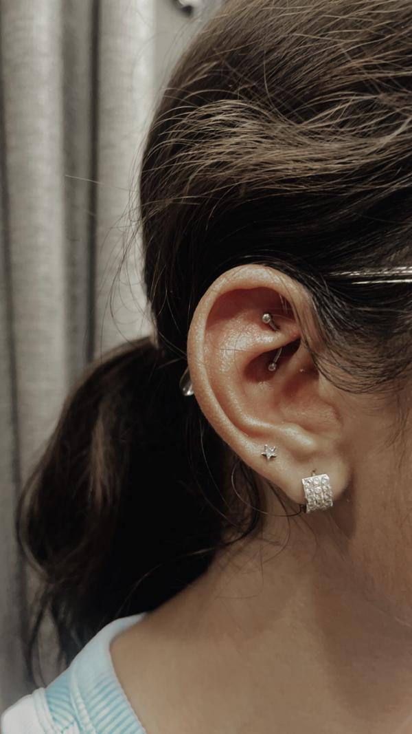 Trendy multiple ear piercings , loved by
