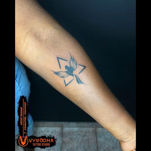 spiritual bird and star tattoo