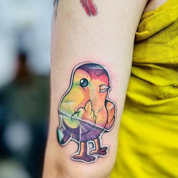 This vibrant sticker style tat